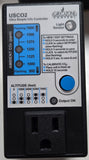 A CO2 Controller power adapter, featuring a black plastic housing, a white front label with blue and black text and graphics, and a blue output button.