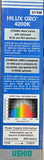 A hand holding a tall blue and white Ushio Hilux Gro 4200K ceramic metal halide lamp box, showing the front label with product details and a color spectrum graph.