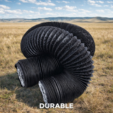 Large black corrugated Mega Mass ducting pipe in a grassy field with 'DURABLE' text.