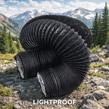 Large black roll of lightproof material on a rocky mountain landscape