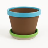 Brown flower pot with blue rim and green saucer on a white background