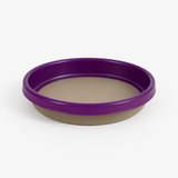 Two-toned purple and beige dish on a white background