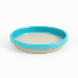 Pet bowl with blue rim on a white background