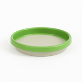 Green lid on a white container with a white background